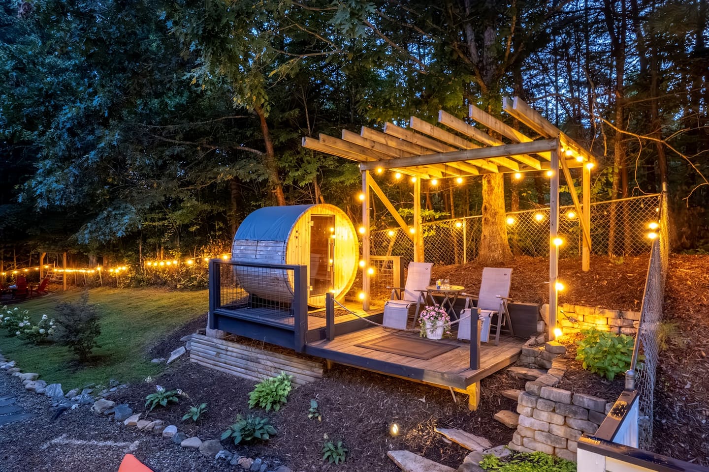 Take the path down to the sauna deck at dusk, pour a drink at the little table, and let the trees do the rest of the talking