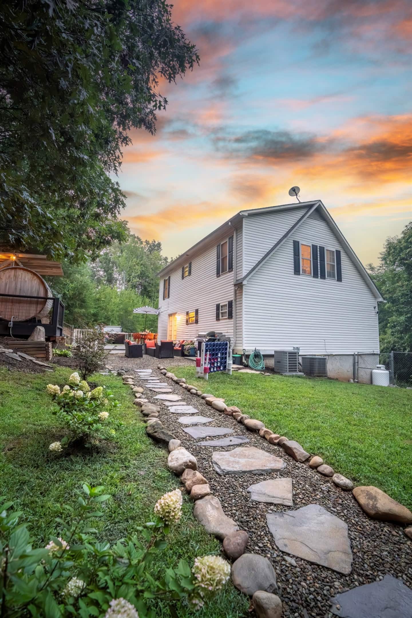 Follow the stone path down to the fire pit at sunset with no mud, no stumbling, just an easy walk to the next part of your