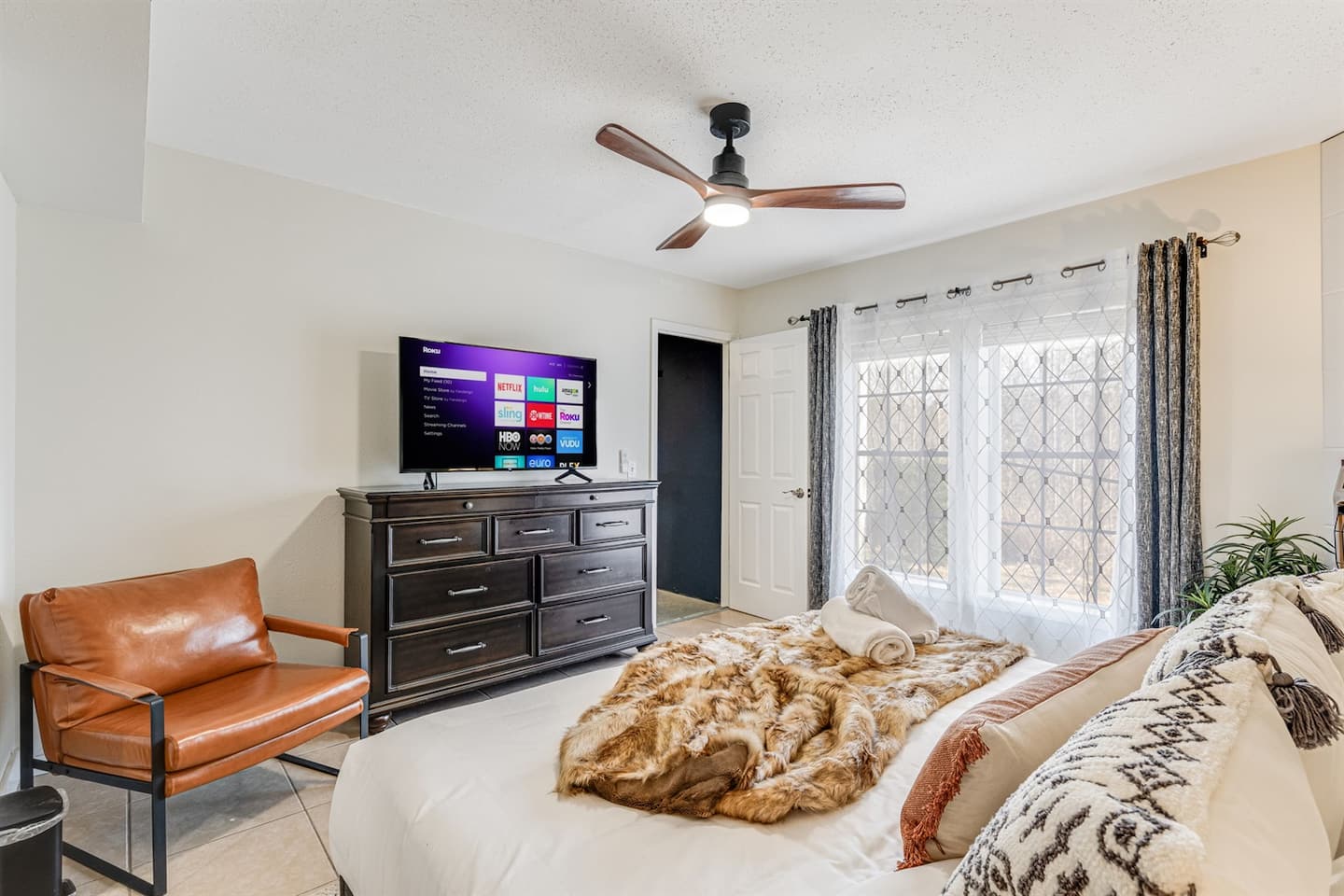 You'll have real room to unpack here with dresser space, a TV, and enough floor to spread out your bags without tripping
