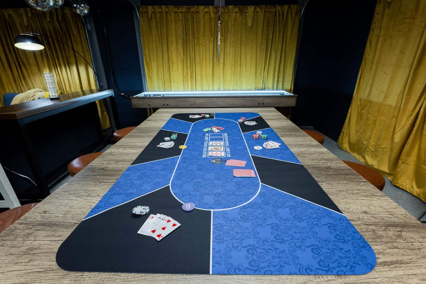 Deal the cards on the felt poker table