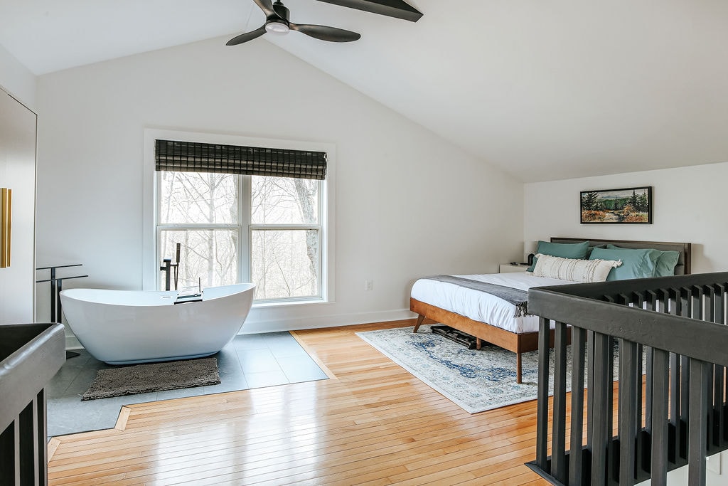 Eagles Nest:  Soak in the tub with forest views, then sink into the queen bed.