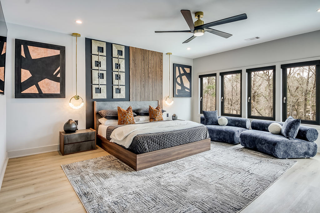 Primary Suite 
unwind in this spacious primary bedroom, featuring a luxurious king-sized bed, soft linens, and a calming color palette. With large windows that fill the room with natural light, it offers a serene and peaceful retreat. 