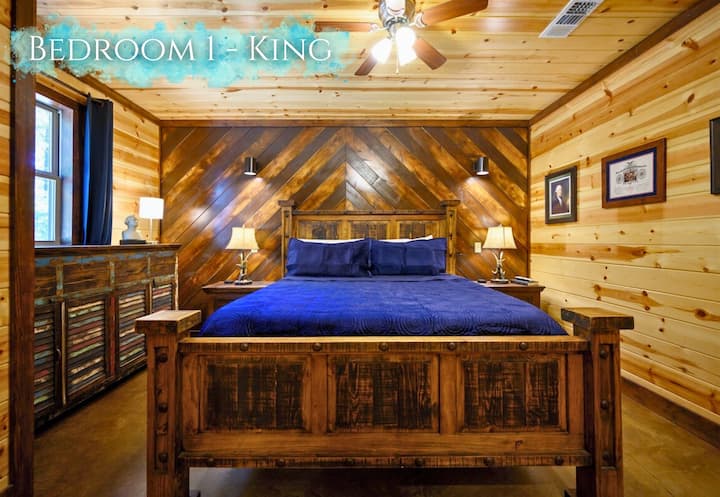 Snuggle up in this king-size haven, featuring rich wood finishes and plush bedding for a royal rest.