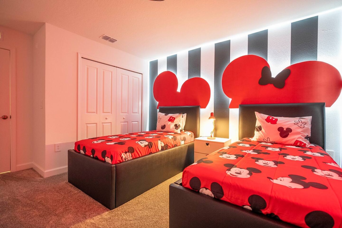 Step into our beautiful and vibrant Mickey Mouse themed kids' room, complete with two cozy single beds. This spacious and comfortable haven is perfect for your little ones to unwind and let their imaginations soar after a day of vacation excitement.