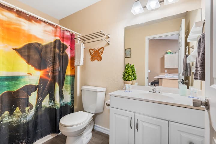 A single vanity & shower/tub combo await in the first full bathroom