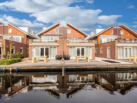 Successful Airbnb property: Large apartment with terrace directly on the wat in Wijk 00 Uitgeest