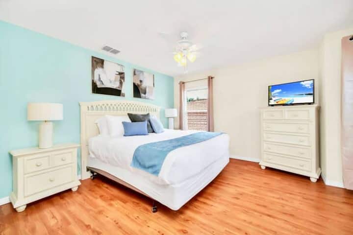 King Bedroom With Tranquil Pastel Decor And Smart TV