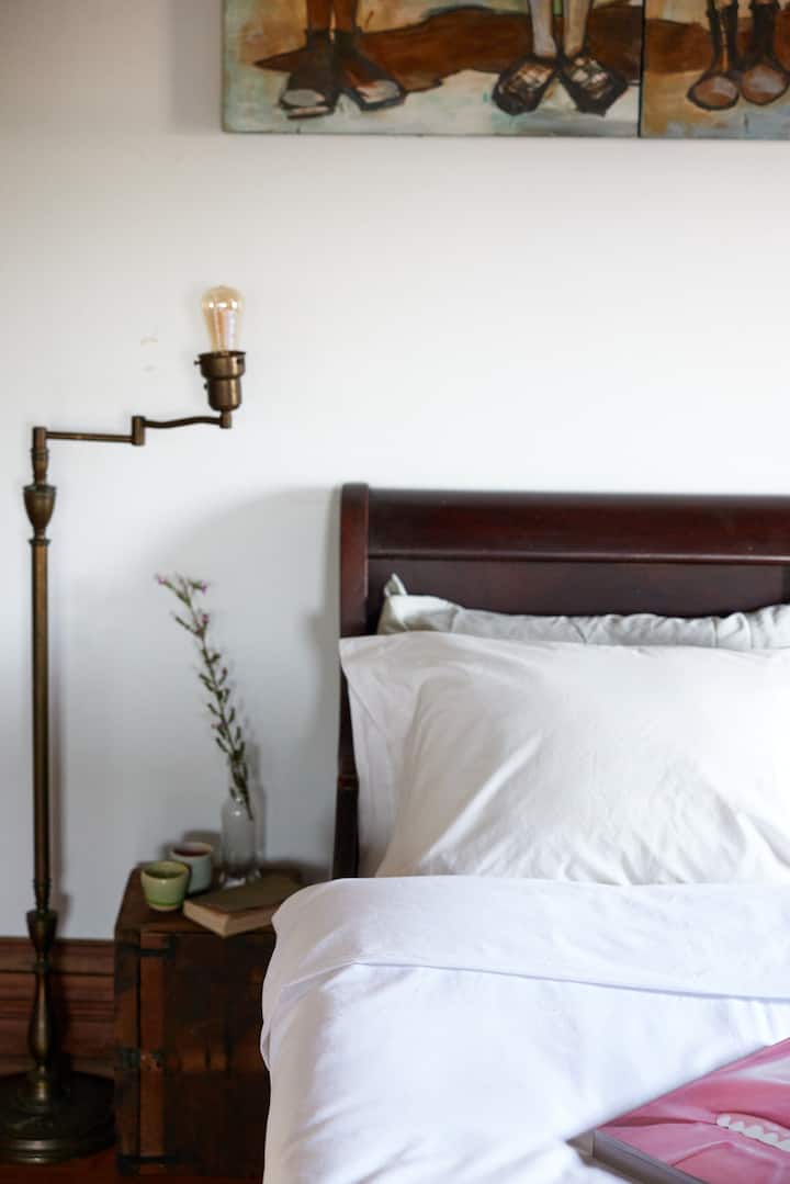 A restored queen sleigh bed with a comfy mattress