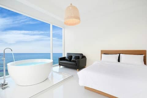 Room with an ocean view from the bathtub, 203 (Bathtub Room)