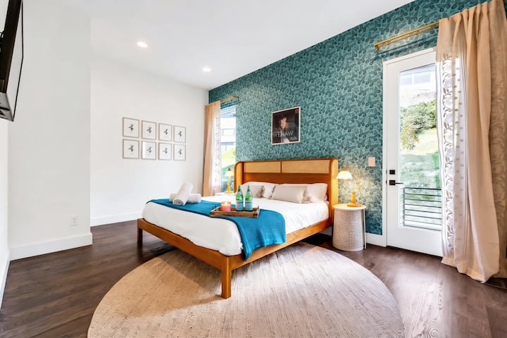 Experience ultimate comfort in this chic bedroom, perfect for your Nashville getaway. Relax with hotel-style amenities and decor that spark joy. Discover your dream stay at Misfit Homes. Reserve your stay today!