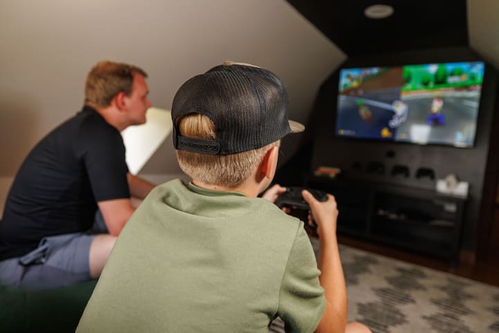 Kick back in the game room and settle old scores over Mario Kart. Comfy setup, classic games, and no kids in sight (unless you brought 'em).