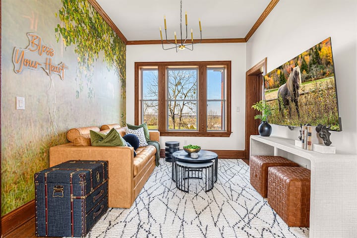 First stop upstairs: the loft. Kick back on the couch, get comfy, and catch up on your favorite show in this bright and stylish hangout spot. Note: blackout curtains have been added for privacy.