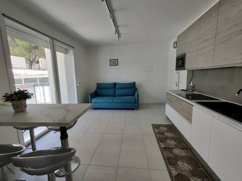 Modern flat with swimming pool by the beach