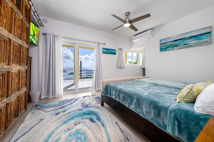 The secondary bedroom with ensuite bath (upper level).