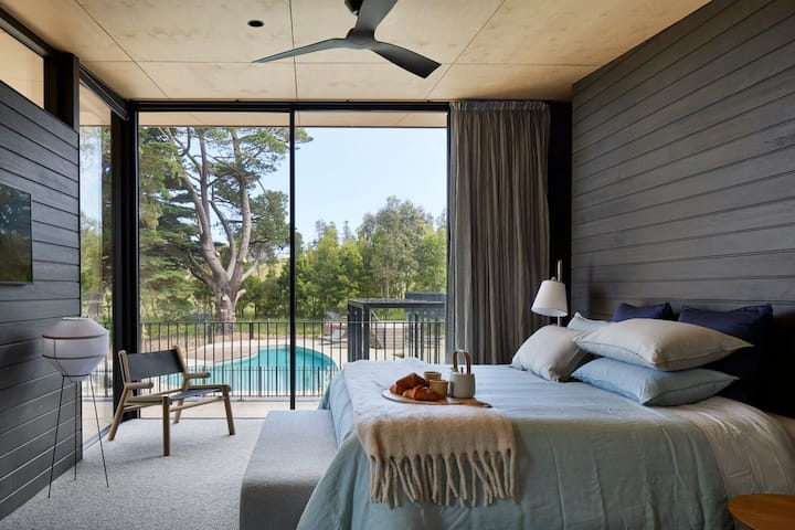 Master bedroom with stunning ensuite and pool views