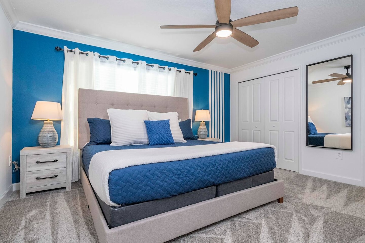 Master bedroom with a king size bed and private bathroom. Second Floor