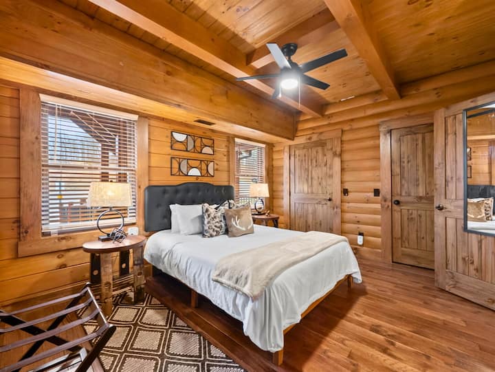 Main-level wheelchair-accessible primary suite near the front entrance — no stairs required, with private accessible bath.