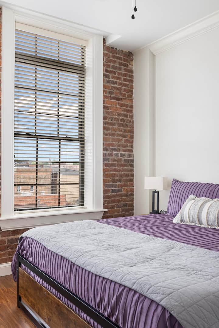 Feel at home in this light-filled bedroom.