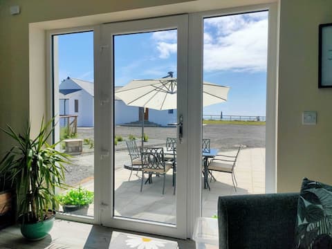 On Cranfield beach modern house sea/mountain views