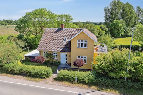 Beautiful yellow country villa by the water