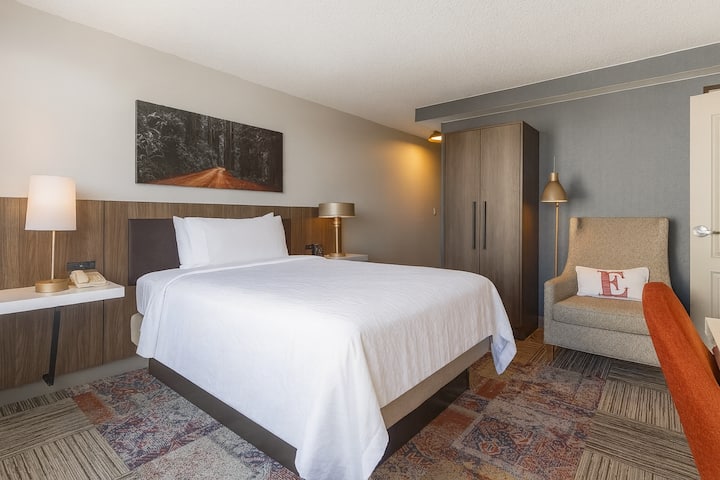 Unwind into crisp linens and soft light in your serene retreat