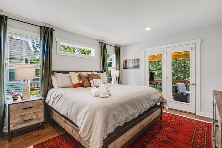 This is our primary bedroom with a king-sized bed and direct access to the outdoors. Located upstairs.