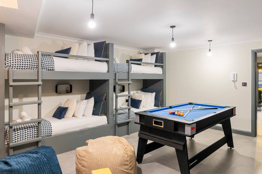Step into the Modern & Funky Games Room & Sauna, a vibrant space designed for fun and relaxation. Enjoy a stylish pool table, catch your favorite shows on the TV, or unwind in one of the two cozy bunk beds, making it the perfect hangout spot.