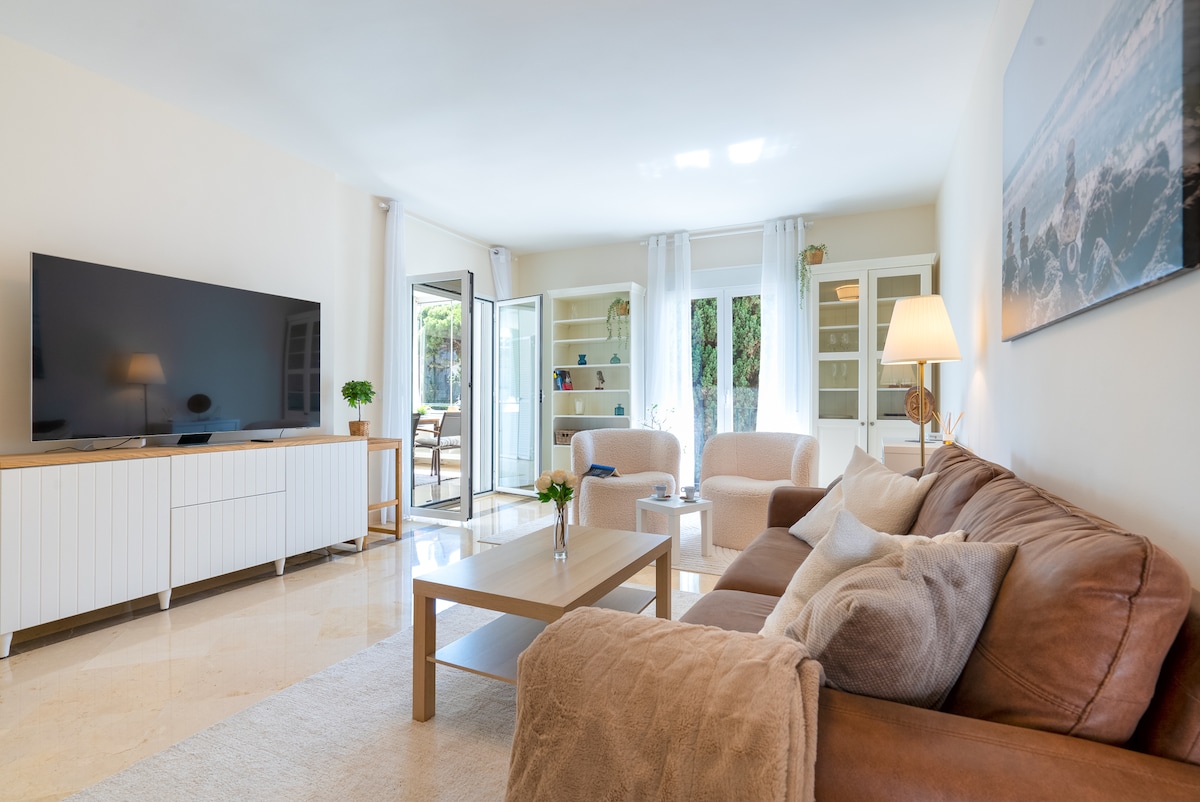 Top Airbnb: Chic 2BR with Sunlit Terrace | 5-Pools | Garage in Estepona