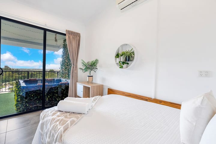 The second bedroom is fitted with a double bed and offers direct access to the balcony.