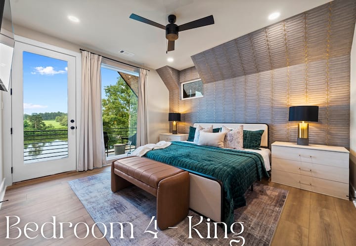 This bedroom features a king-sized bed with luxurious bedding and plush pillows, ensuring a restful and comfortable sleep.