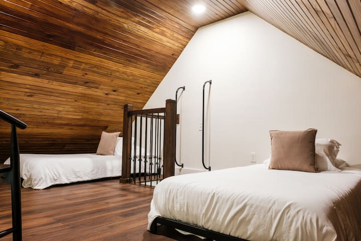 The third floor loft is accessible by ladder and provides a unique sleeping experience on the 2 XL twin beds. The beds can easily be moved together to make a king bed for couples.
