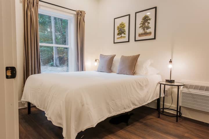In the main floor bedroom you'll love the comfortable memory foam queen mattress. The paintings above the bed are custom watercolors of some of our favorite trees on the property because you can never have enough views of the woods surrounding you!
