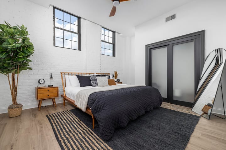 A serene escape in the heart of downtown – this bedroom is your cozy retreat with plenty of natural light.