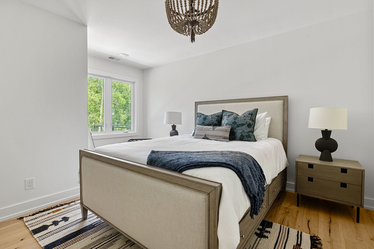 Bedroom 2 is on the main level & has a queen-size bed.