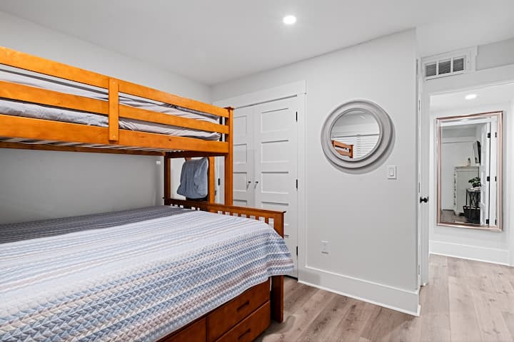 Bedroom 2 with queen bunk bed and 2 twin beds. One twin bed pulls out from under the queen bed. 