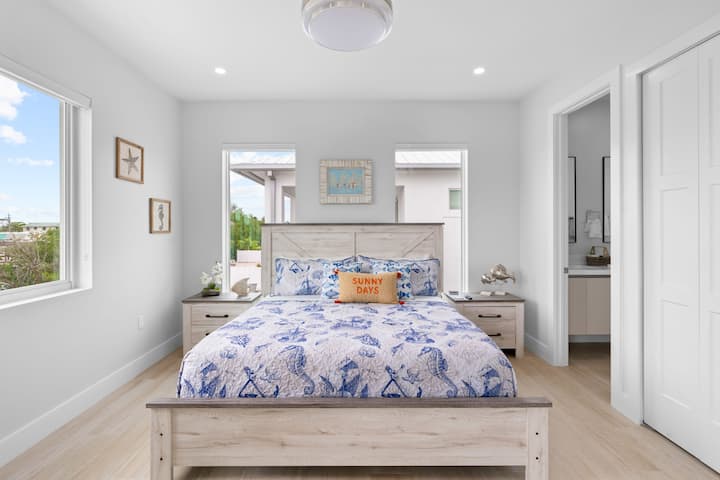 Elevate your bedroom setup with a perfectly made bed and a modern flat screen TV. The ultimate relaxation zone awaits!