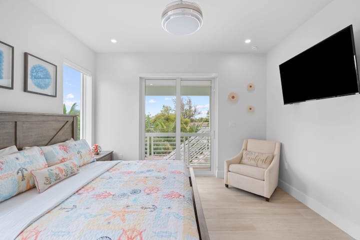 Create the ultimate relaxation spot with a perfectly made bed and an entertainment hub right in your bedroom