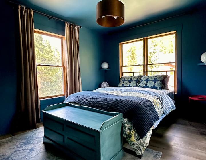 'Blue' bedroom with queen-size bed, built-in closet, extra storage. Not seen: wall mounted TV.