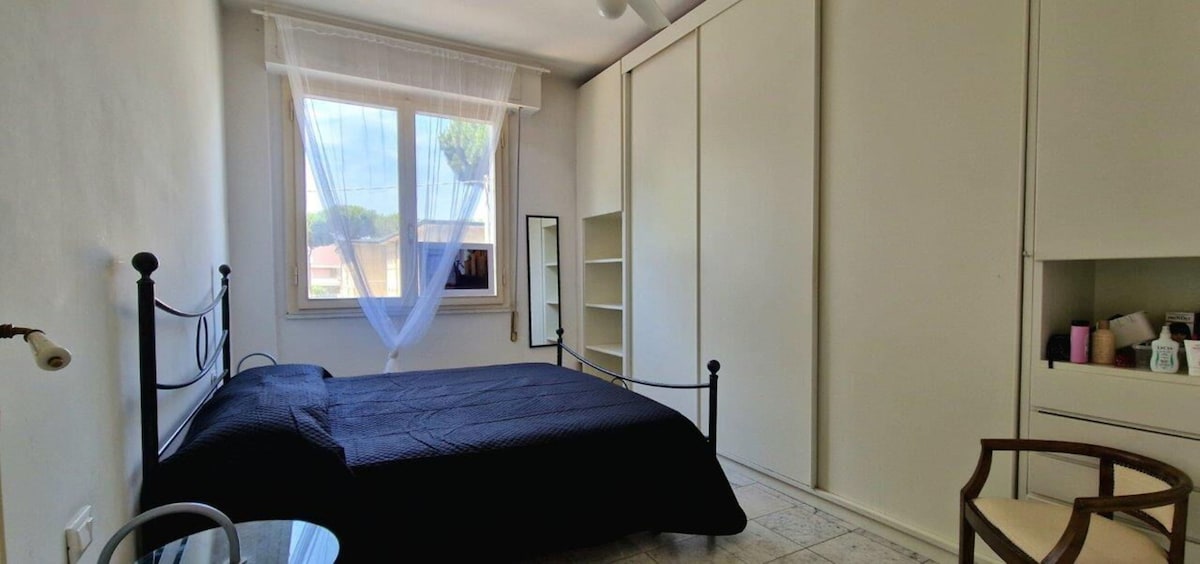 A bedroom with an air-conditioned double bed.