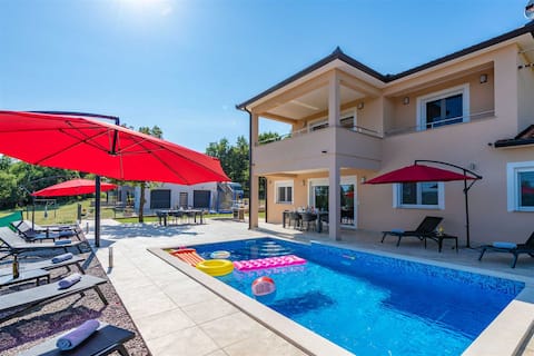 Two apartment villa with pool close to the sea