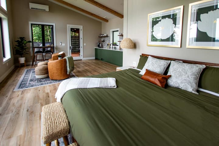 King bed, living area and kitchen