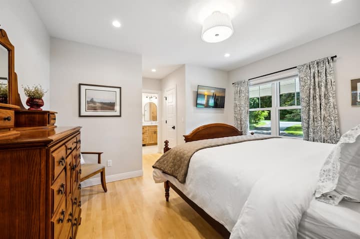 The primary bedroom suite is conveniently on the first floor, and has a King size bed, walk-in closets, Roku TV, and room darkening shades. All of our bedrooms have ensuite baths and unlike many rentals, duvet covers are always changed between guests