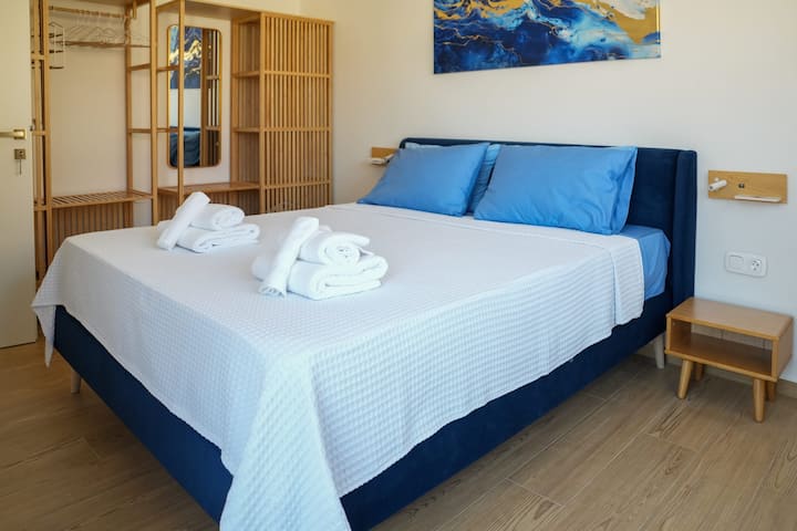 Bright and Cozy Double Bed with Side Tables and Wooden Finishes – Bedroom 

