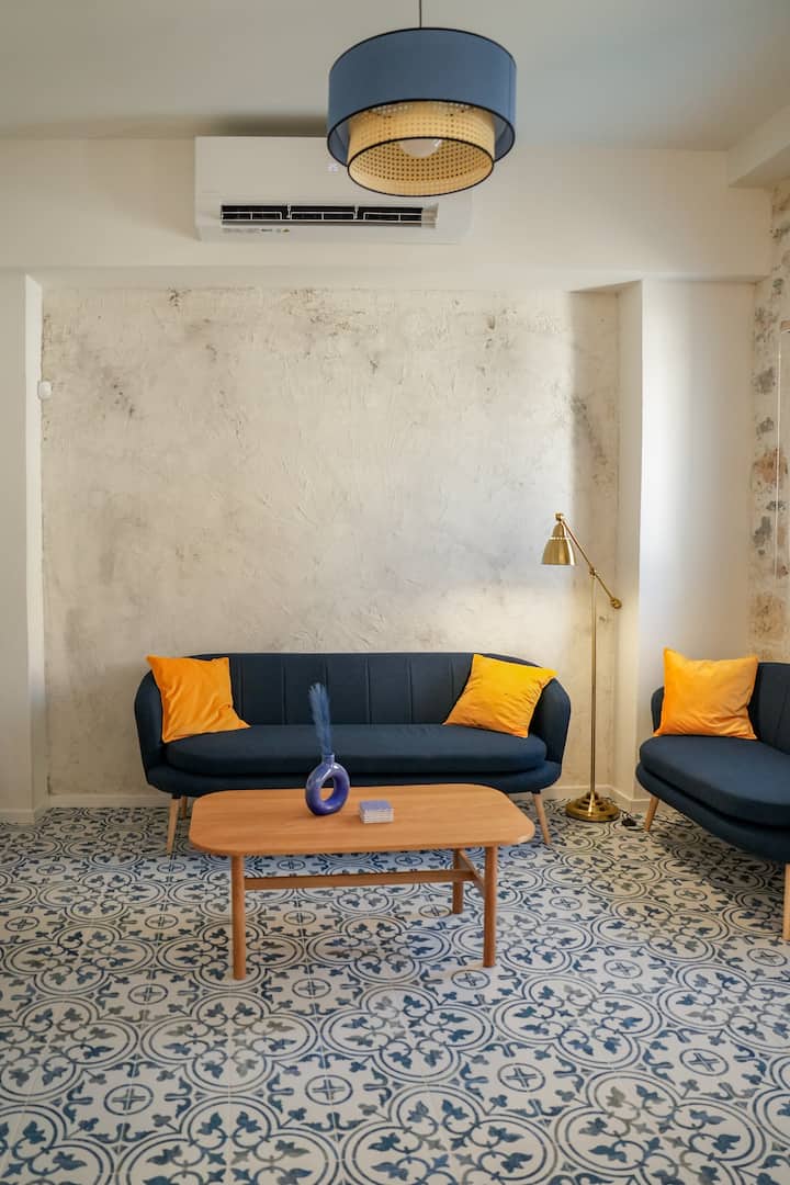 Well-Styled Living Room Details with Wall Lighting and Artistic Decor Touches

