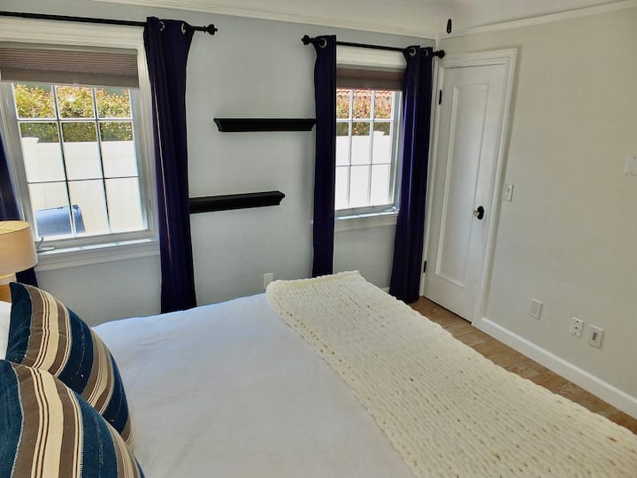 The second bedroom retreat features a regal king-sized bed