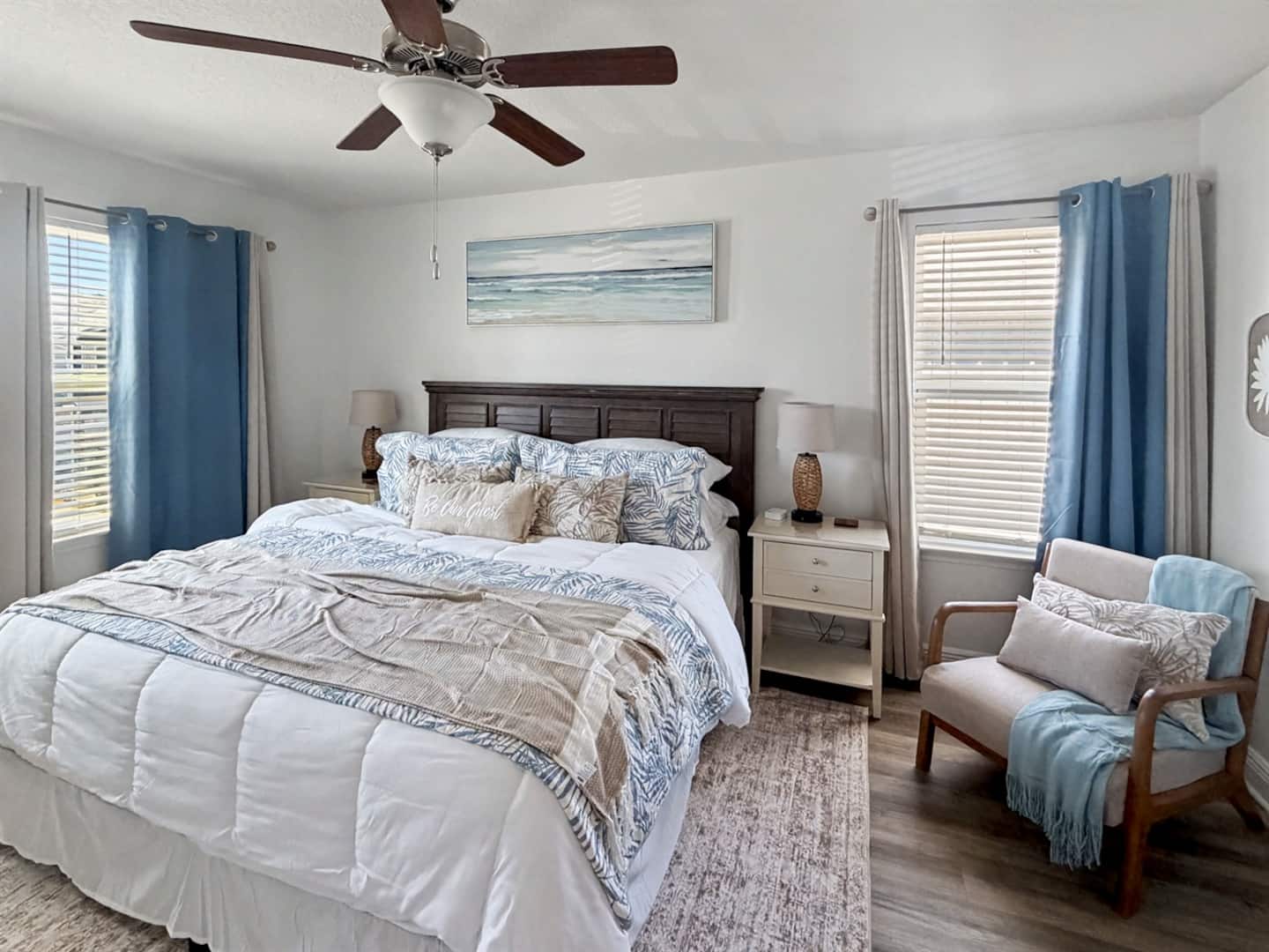 Unwind in the primary bedroom with room-darkening plus black-out shades, ensuring a peaceful sleep