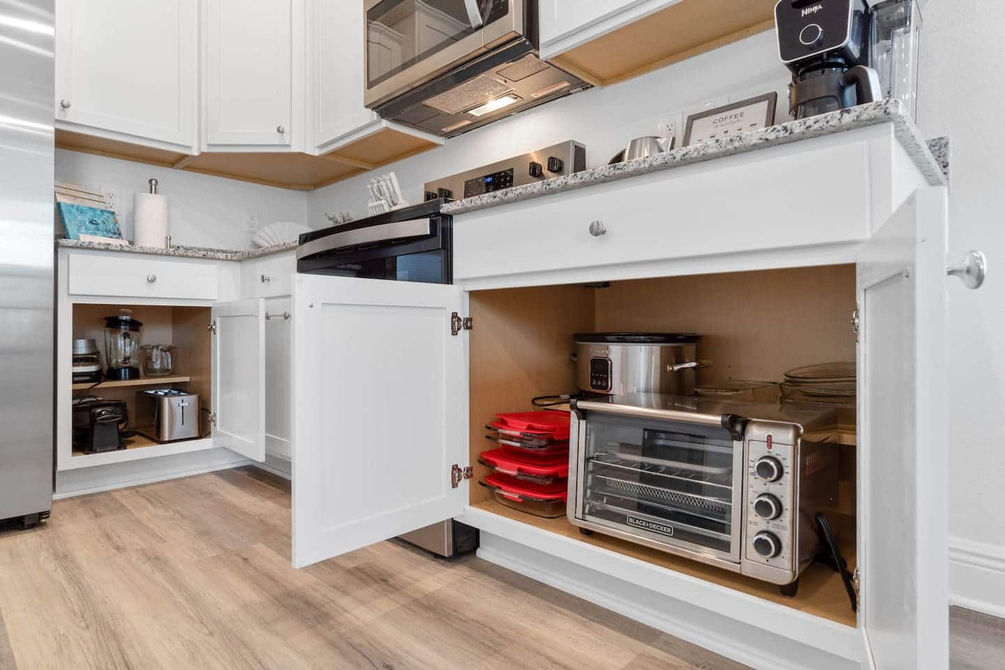 Inside the Cabinets: mixing bowls, dual waffle maker, toaster, blender, egg cooker, mixer, food processor, crock pot, 6-Slice Crisp 'N…