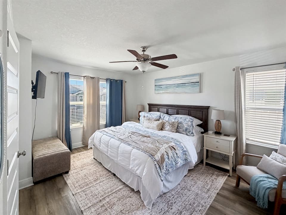 Primary bedroom with king bed, blackout shades and 42-inch Roku TV