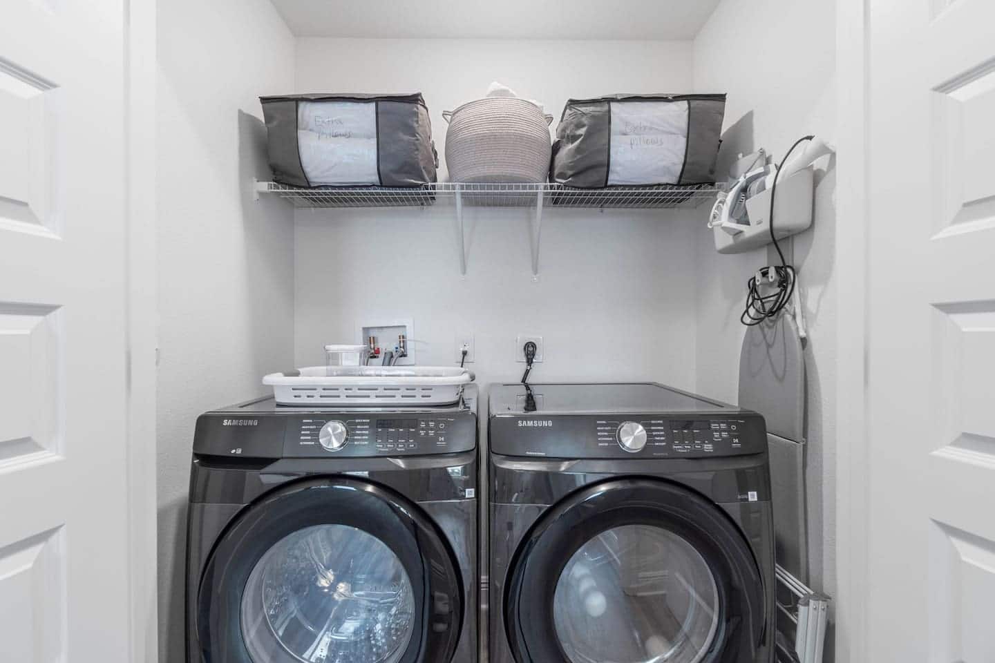 Washer, dryer, iron with ironing board, laundry basket, drying rack, steamer, extra towels and pillows for your convenience
