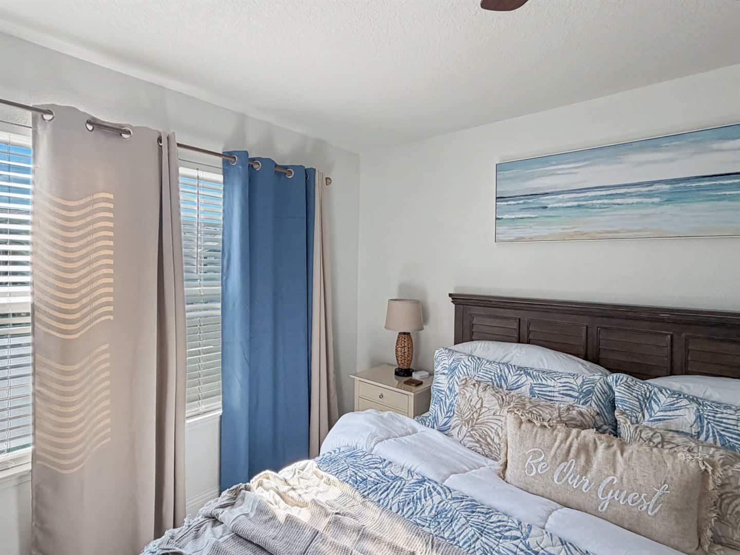 Unwind in the primary bedroom with room-darkening plus black-out shades, ensuring a peaceful sleep